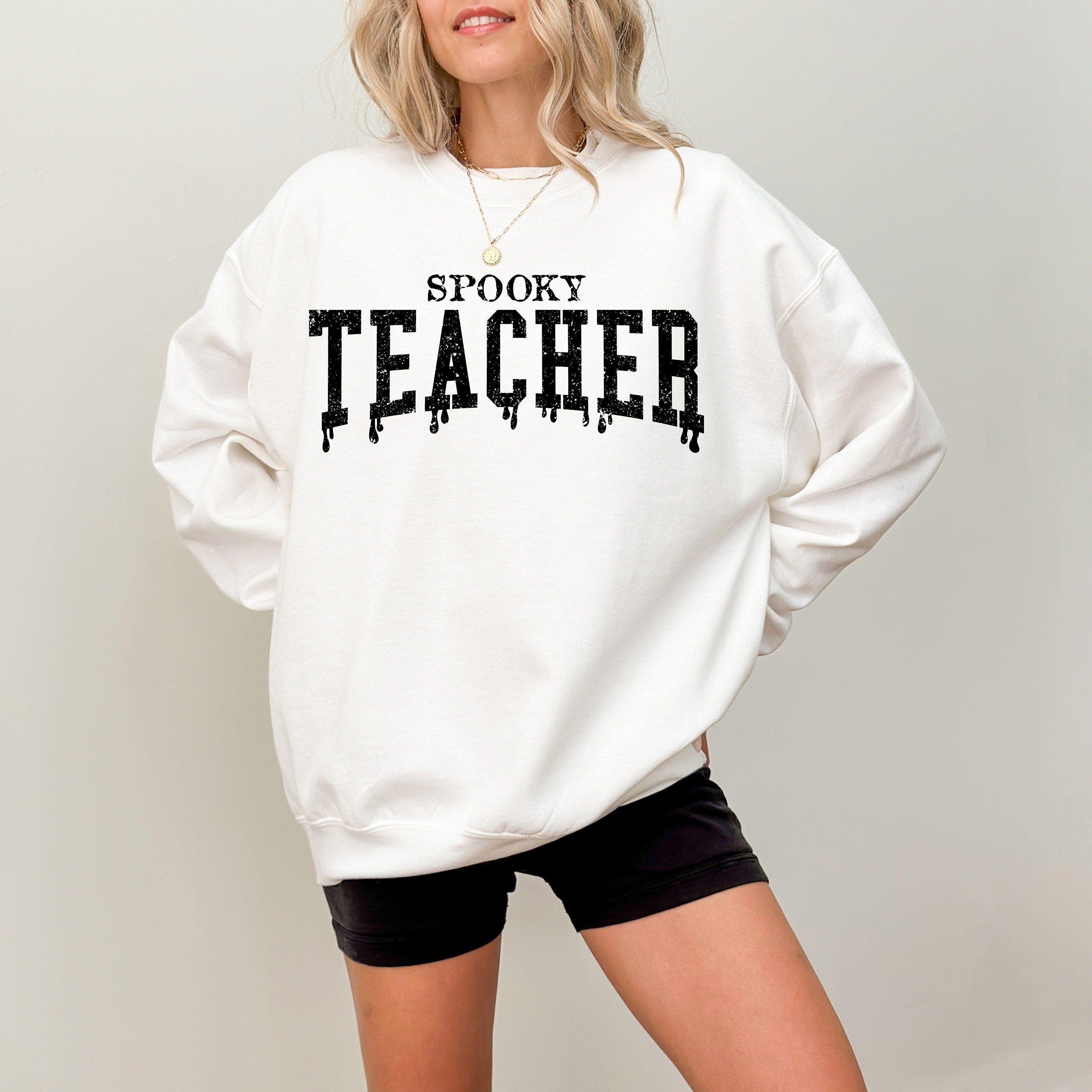 Spooky teacher dripping text on a crewneck sweatshirt