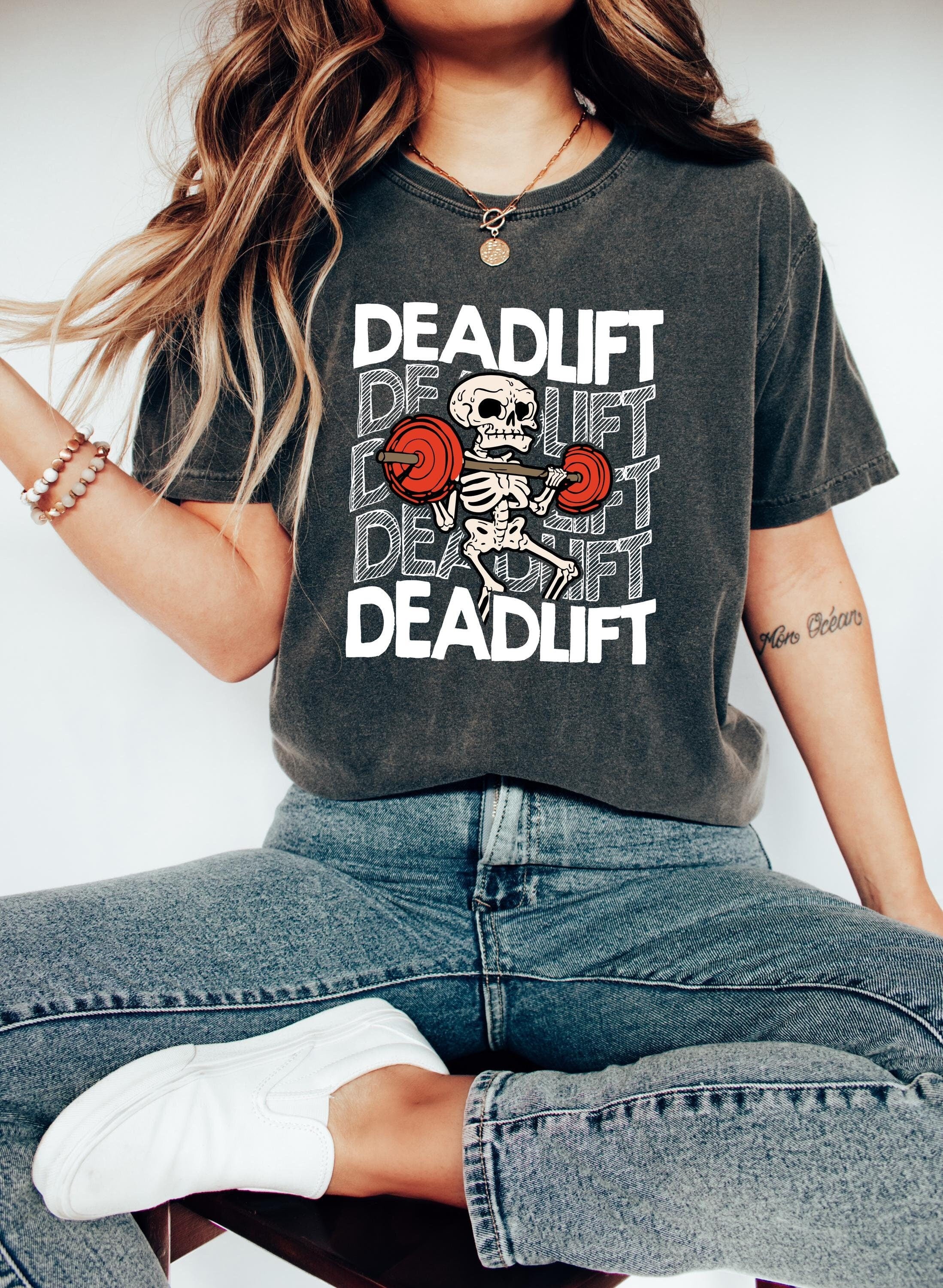 Dead lifting skeleton on a pepper comfort colors tshirt