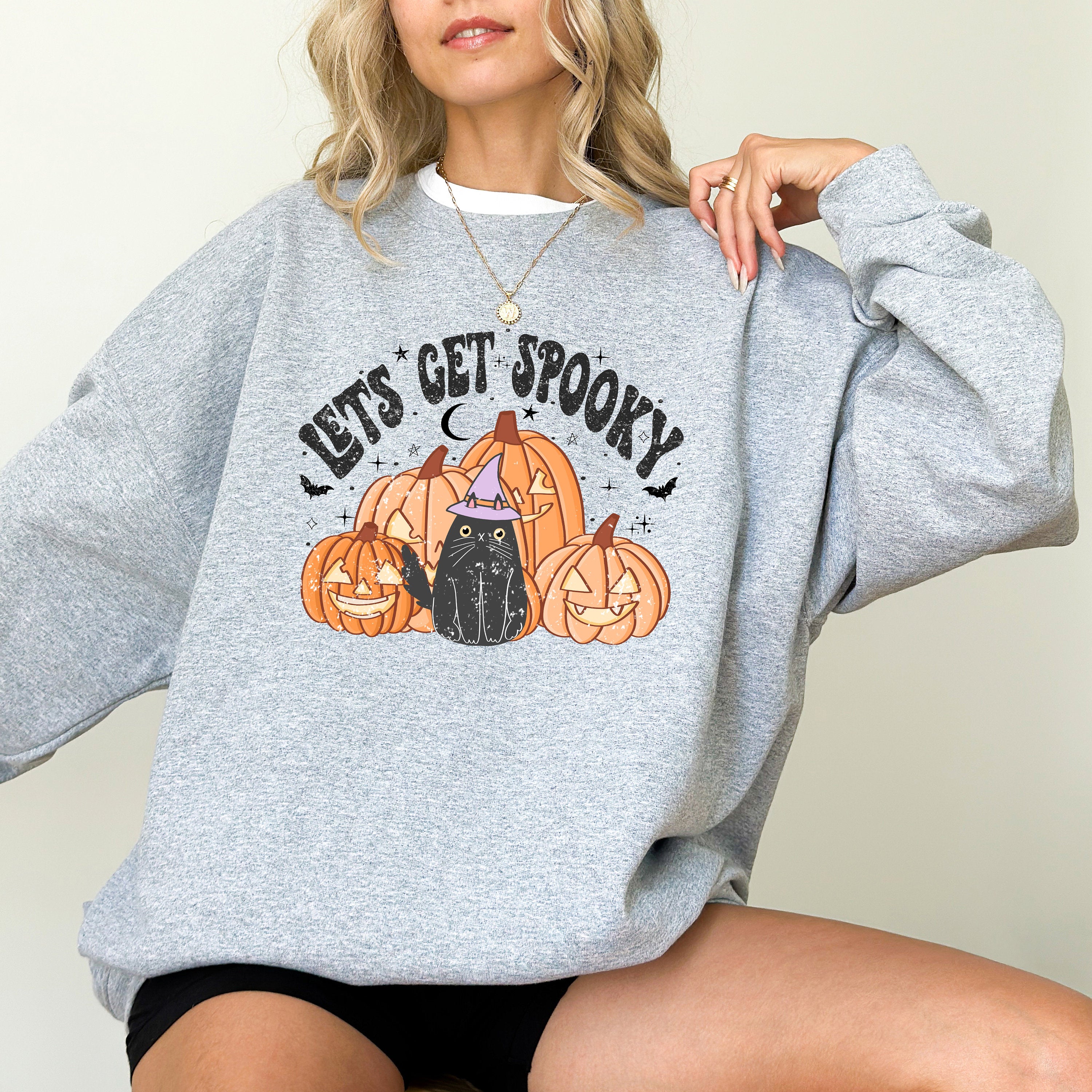 Lets get spooky retro halloween design on crewneck sweatshirt, black cat and jack o lanterns