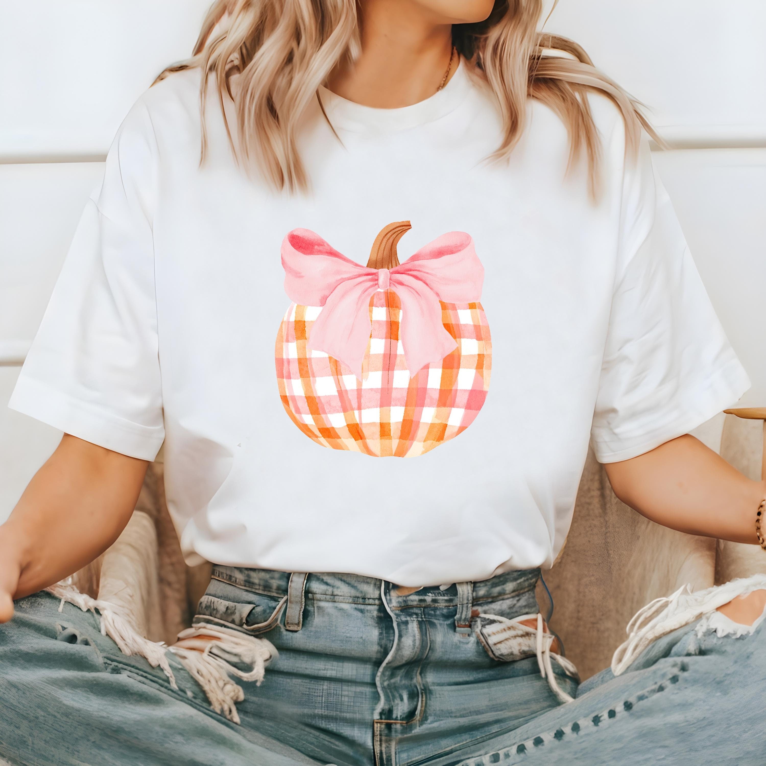 Cute water color plaid pumpkin with a pink bow.